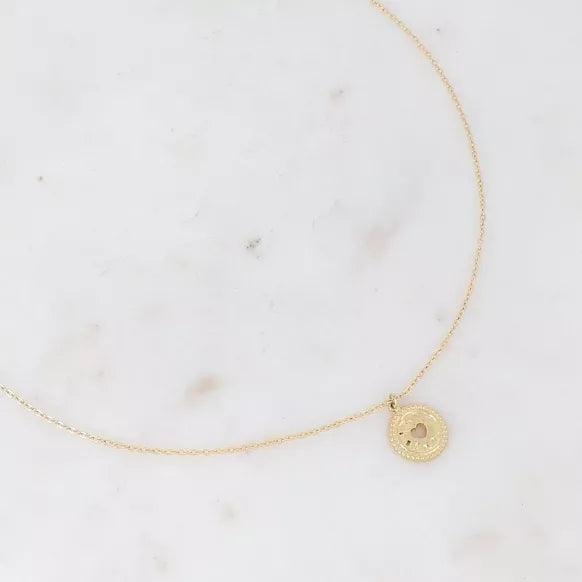 Tyma necklace - hammered pendant with openwork heart.