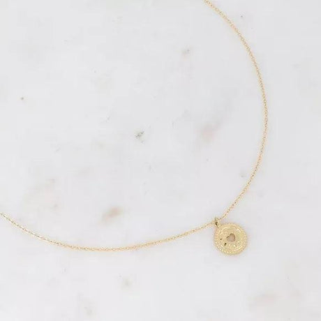 Tyma necklace - hammered pendant with openwork heart.
