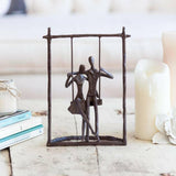 Couple on a Swing Cast Bronze Sculpture.