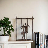 Couple on a Swing Cast Bronze Sculpture.