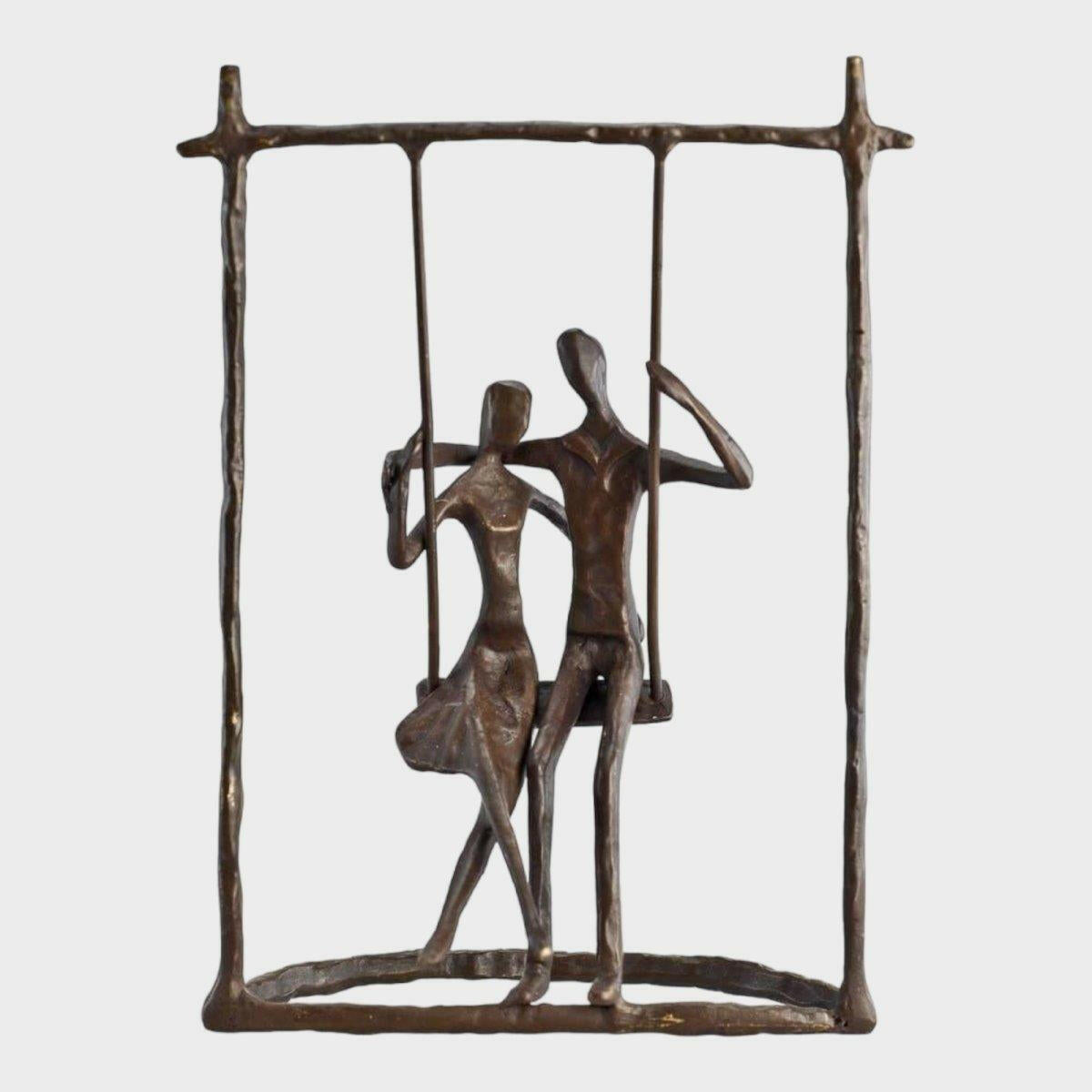 Couple on a Swing Cast Bronze Sculpture.